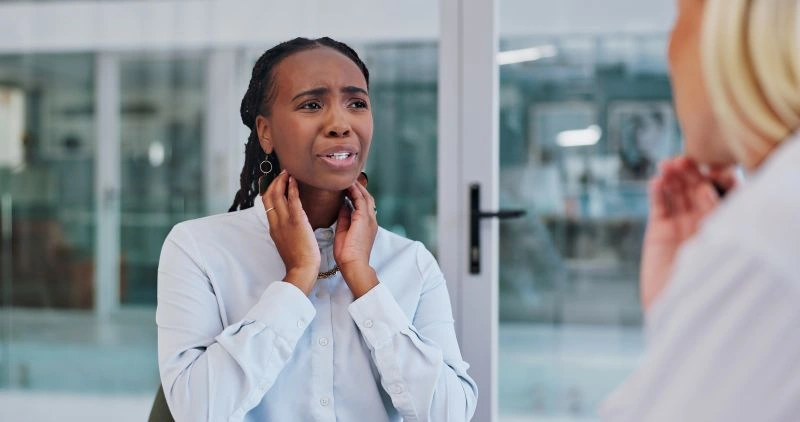 A woman showing signs of distress during a therapy session, highlighting the emotional challenges of borderline personality disorder and the need for effective treatments.