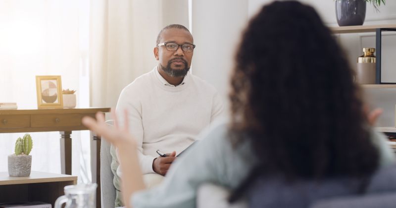 Anxiety specialist conducting a therapy session with a patient, focusing on mental health management.