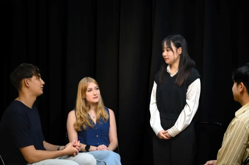 Group therapy session focusing on treatment for social anxiety and blushing, with participants engaging in a supportive discussion.