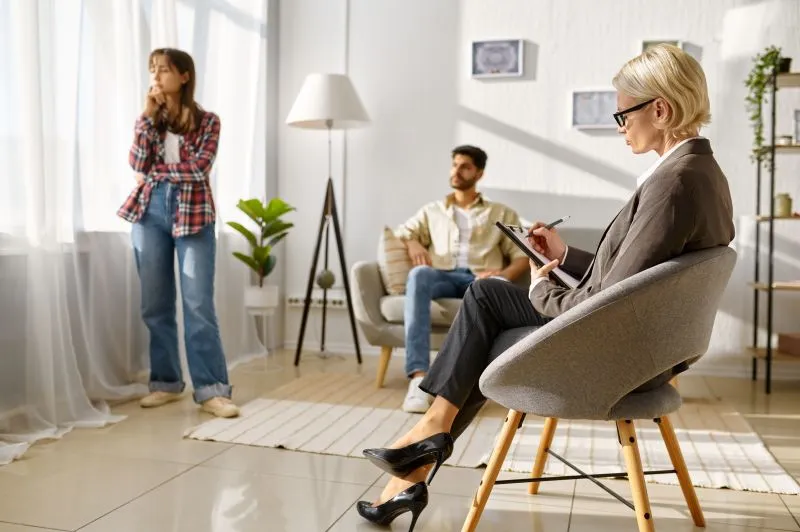 Psychotherapist guiding clients while comparing psychotherapy vs talk therapy approaches in practice.