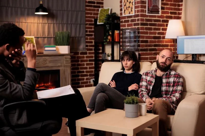 A couple attending therapy to address relationship challenges, seeking professional support through therapy vs psychiatry for emotional well-being.