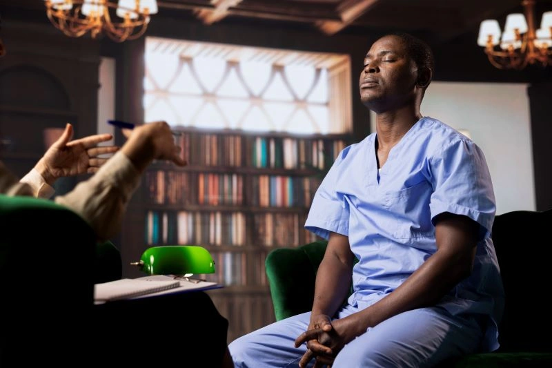 Silence therapy: A man practices mindfulness in therapy, focusing on inner peace and reflection during a quiet, therapeutic session.