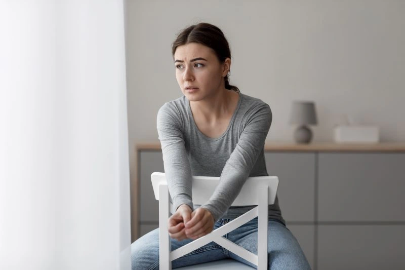 Cognitive Behavioral Therapy for General Anxiety Disorder: A woman feeling anxious, reflecting on how CBT can help address and reduce anxiety over time.