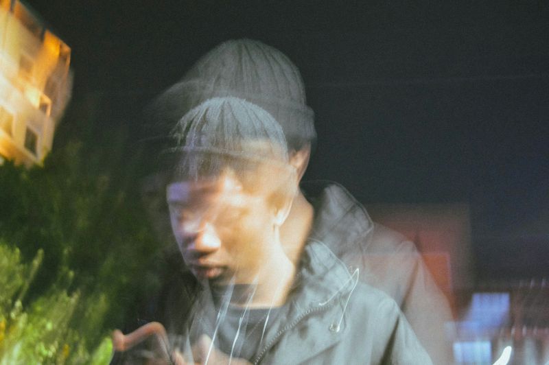 Blurred portrait representing racing thoughts and emotional stress linked to ADHD and social anxiety.