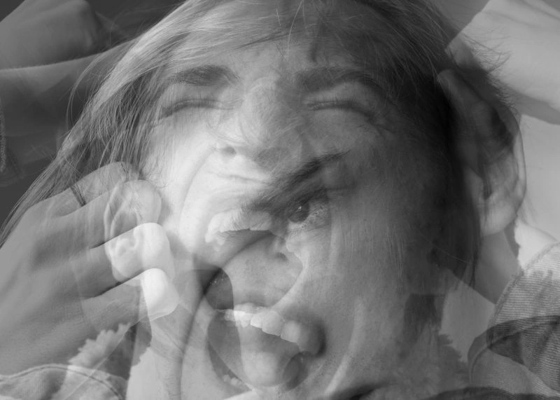 Person experiencing emotional numbness and distress, representing the effects of emotional blunting and difficulty expressing feelings.