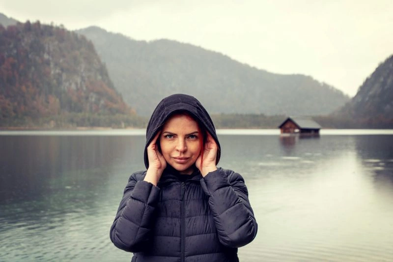 Person standing outdoors in cold weather, illustrating seasonal affective disorder bipolar symptoms linked to seasonal mood shifts.